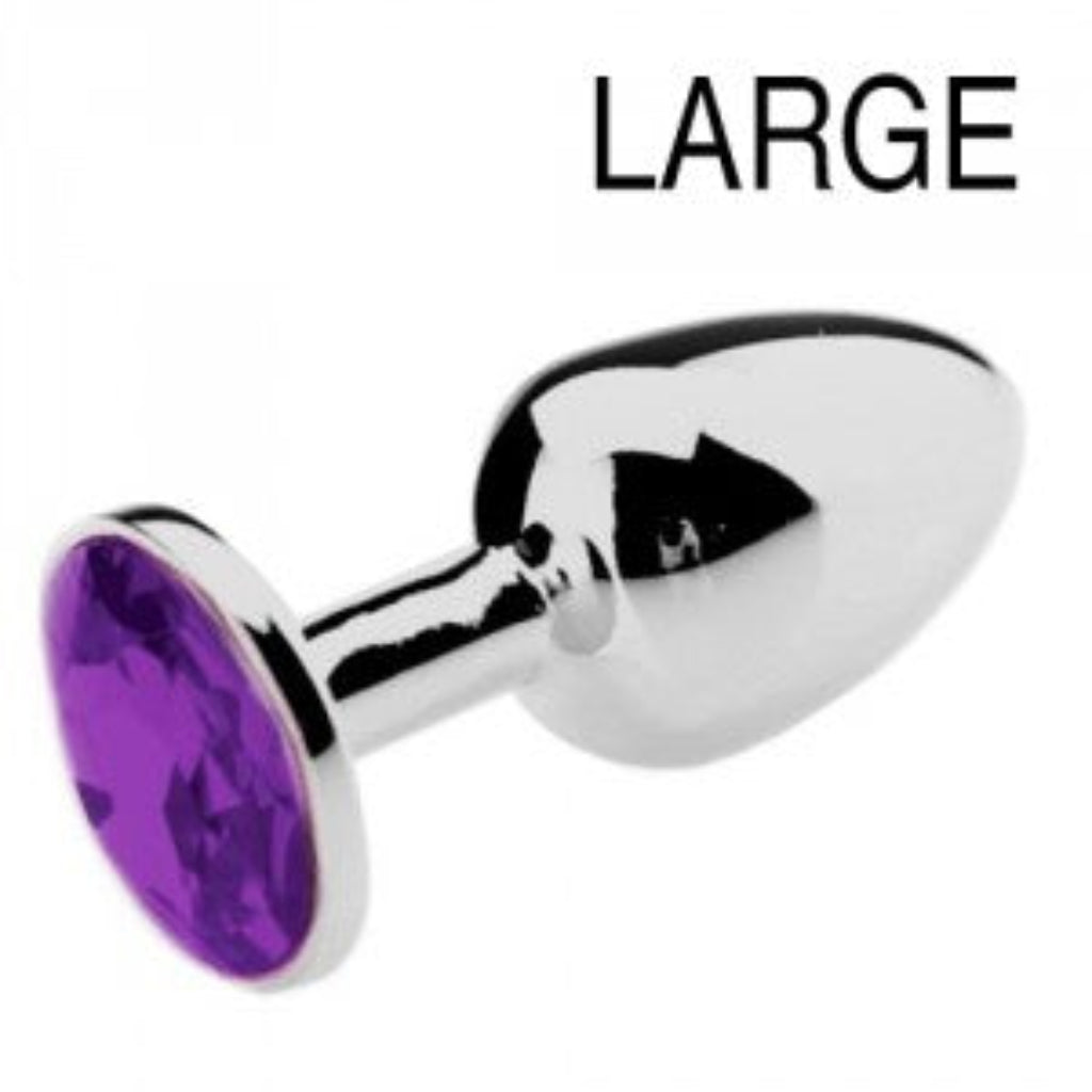 Détail de la pierre violette sertie sur plug anal bijou, reflets profonds