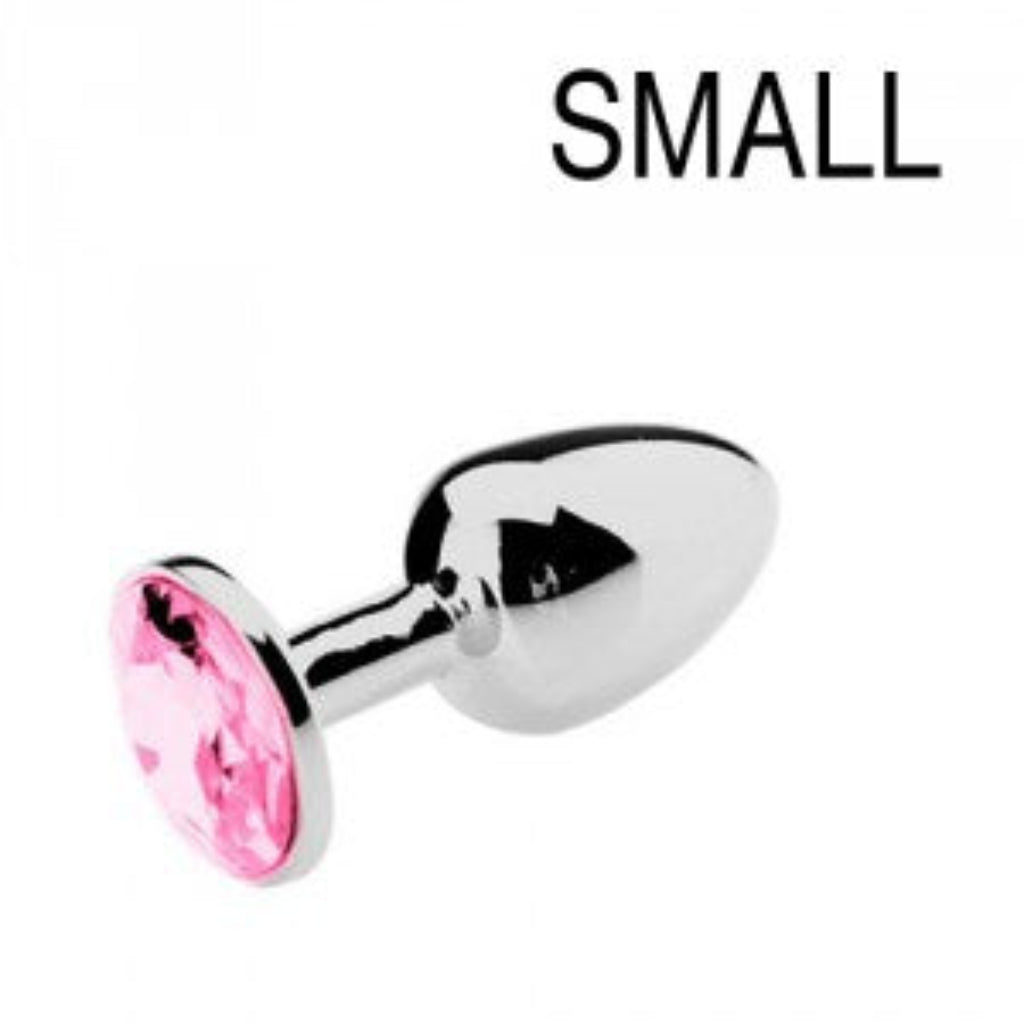 Plug anal en acier inoxydable orné d'une pierre rose, fond blanc