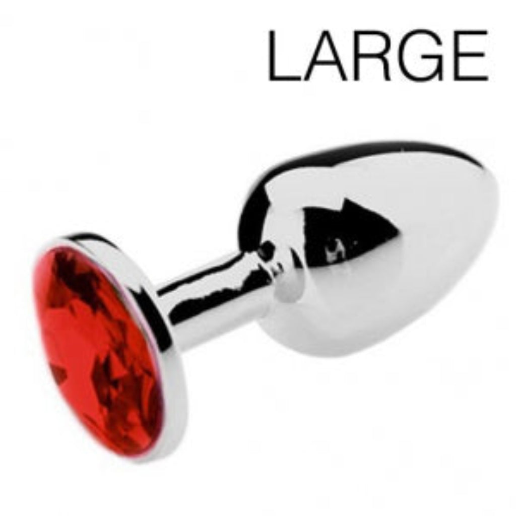 Détail de la pierre rouge sertie sur plug anal bijou, reflets intenses