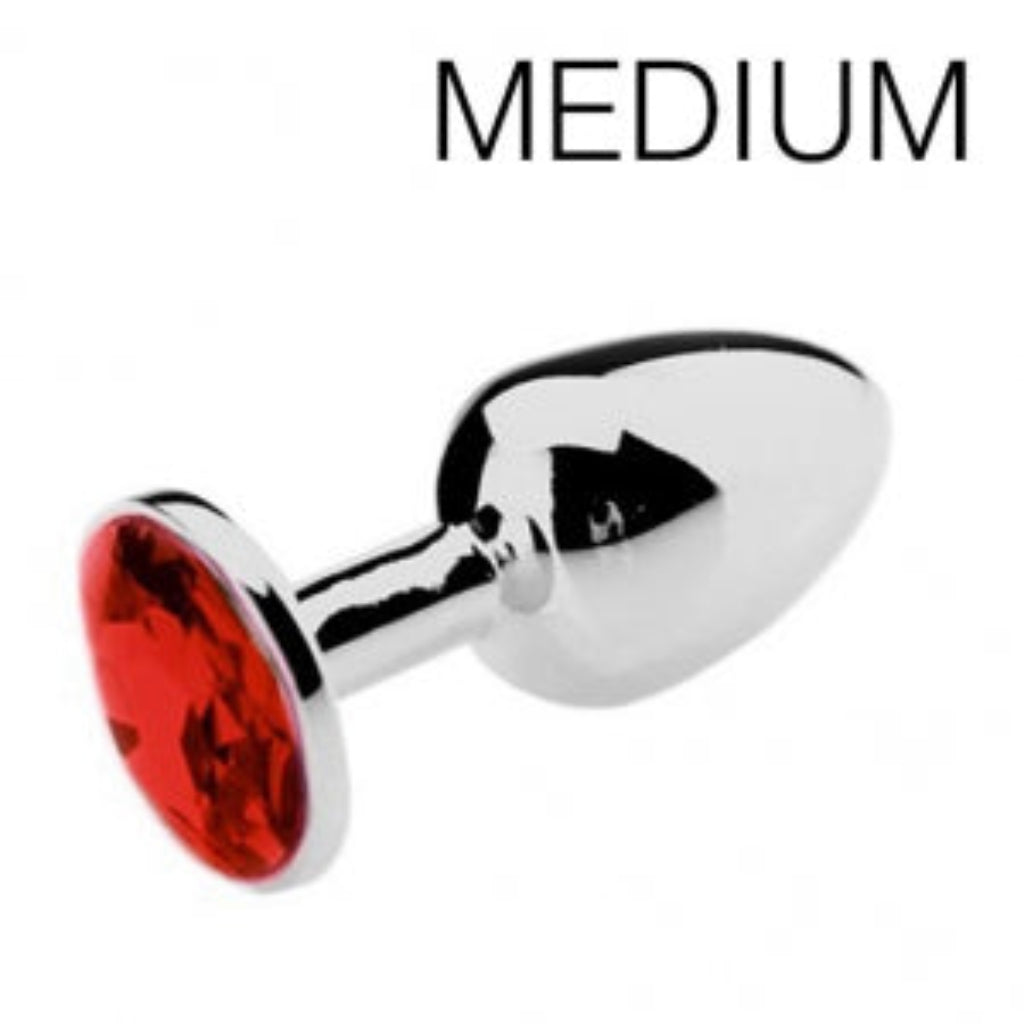 Plug anal bijou avec pierre rouge, profil élégant, finition argentée polie
