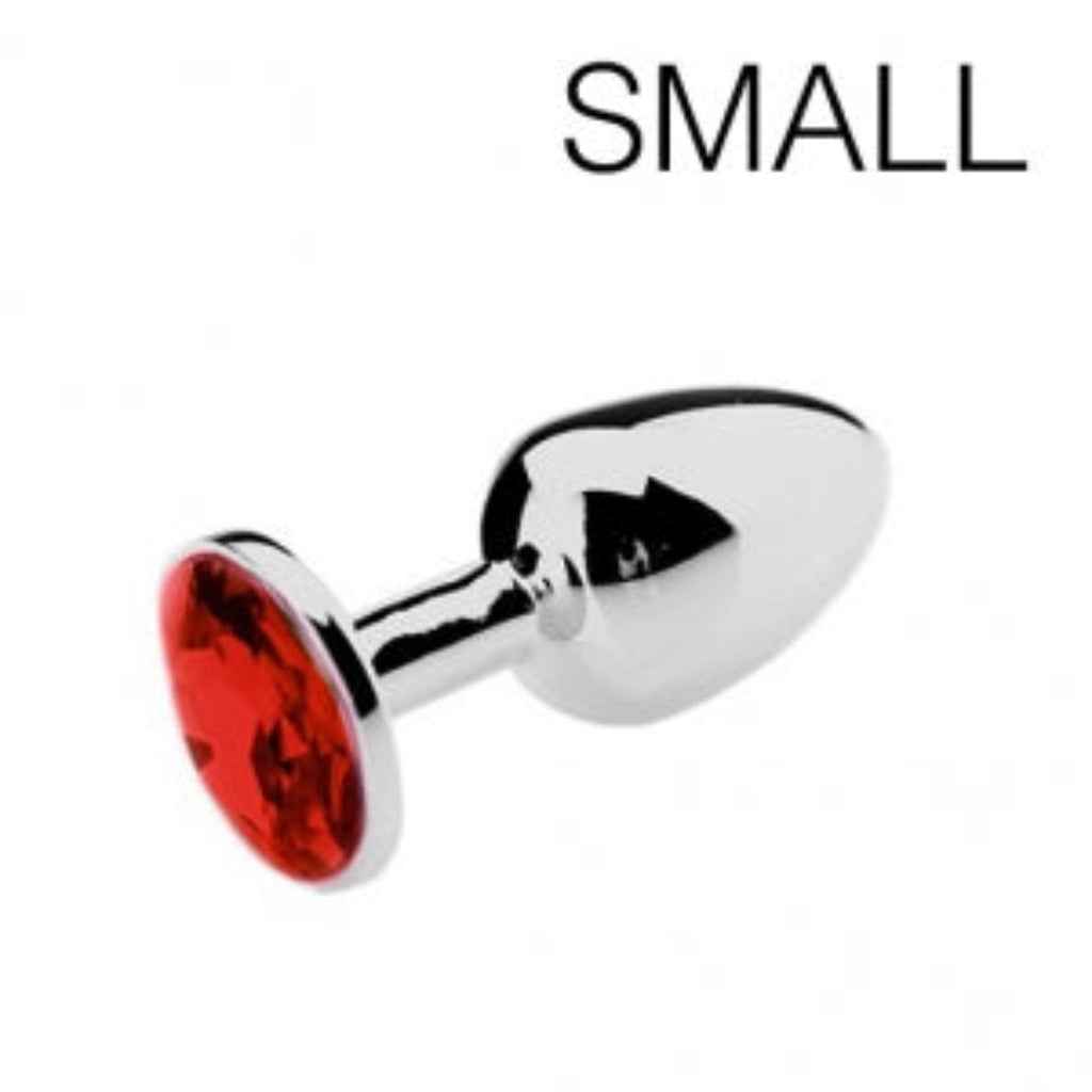 Plug anal en acier inoxydable orné d'une pierre rouge, fond blanc